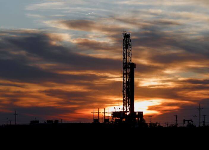 An oil rig stands against the setting sun in Midland, Texas on Friday, April 17, 2020. (Odessa American/Eli Hartman)